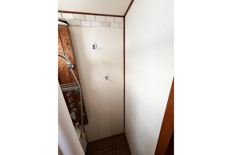 Slide: The Image of Shower area in 1989 Jefferson Marquessa 52 Extended Deckhouse yacht with wooden paneling. - 84