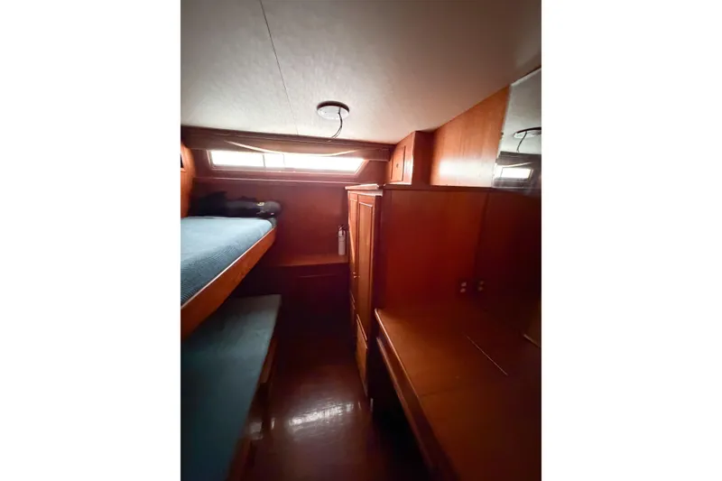Slide: The Image of Cozy cabin interior of 1989 Jefferson Marquessa 52 yacht with wooden furnishings. - 96