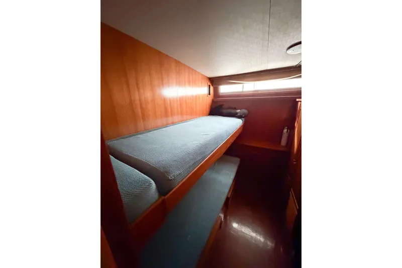 Slide: The Image of Bunk beds in 1989 Jefferson Marquessa 52 Extended Deckhouse, featuring wooden interior and natural light. - 97