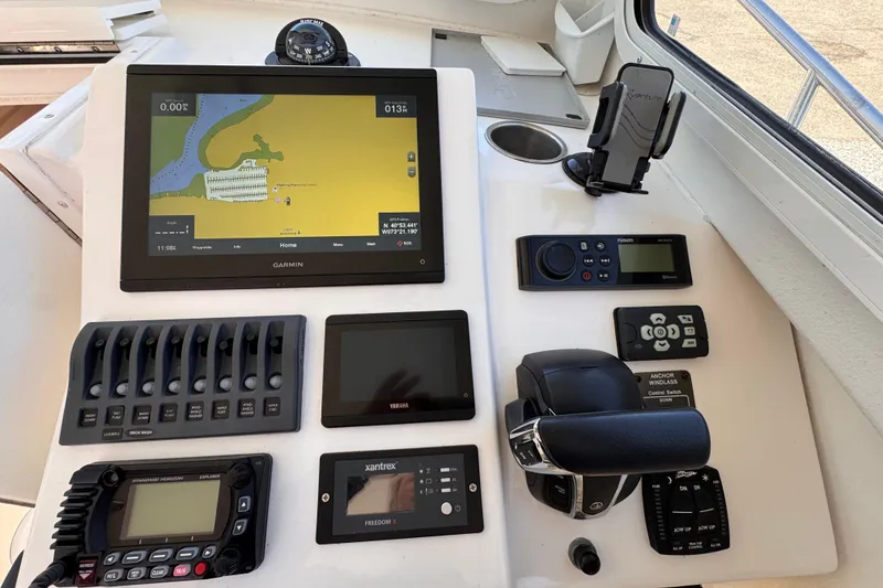 Slide: The Image of Steiger Craft 25 Chesapeake 2021 helm with navigation and control systems. - 13