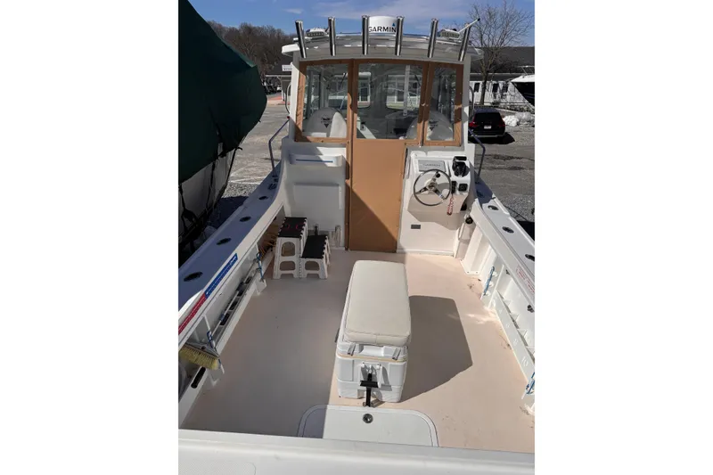Slide: The Image of 2021 Steiger Craft 25 Chesapeake boat interior with helm and seating area. - 17