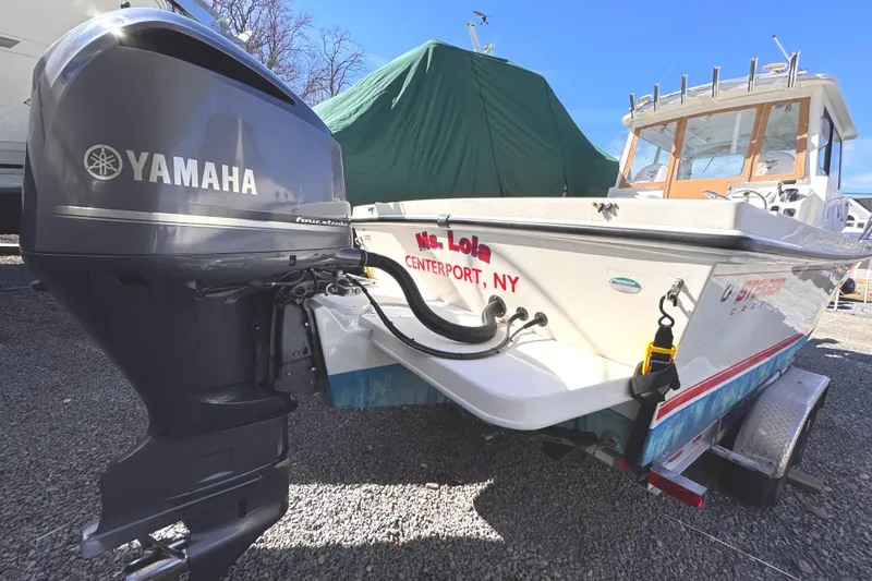 Slide: The Image of 2021 Steiger Craft 25 Chesapeake boat with Yamaha outboard motor, docked in Centerport, NY. - 2