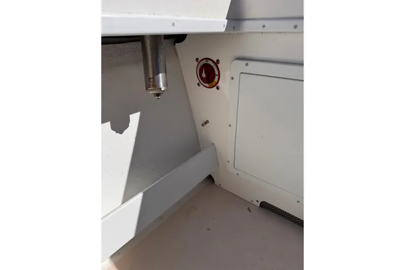 Slide: The Image of Interior view of a 2021 Steiger Craft 25 Chesapeake boat, featuring a control panel. - 21