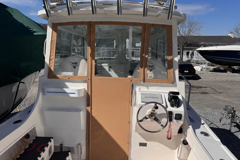Slide: The Image of 2021 Steiger Craft 25 Chesapeake boat cockpit with Garmin navigation system. - 22