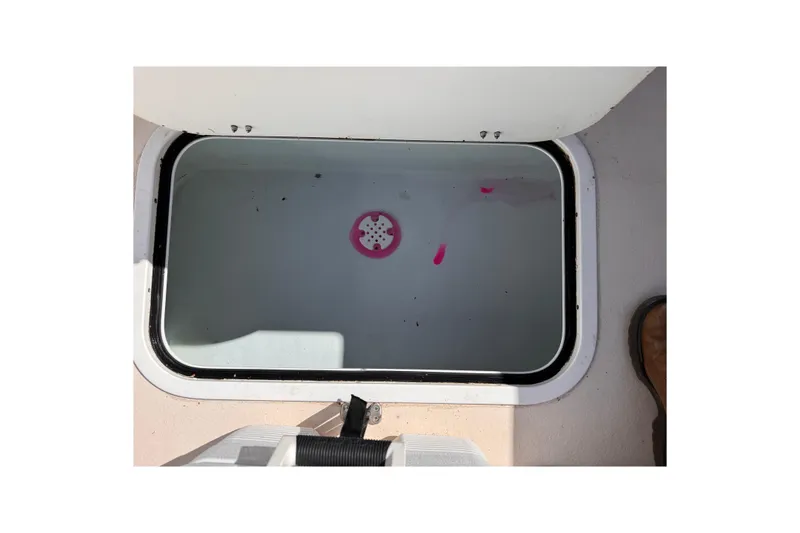 Slide: The Image of Open hatch on 2021 Steiger Craft 25 Chesapeake boat, showing interior compartment. - 24