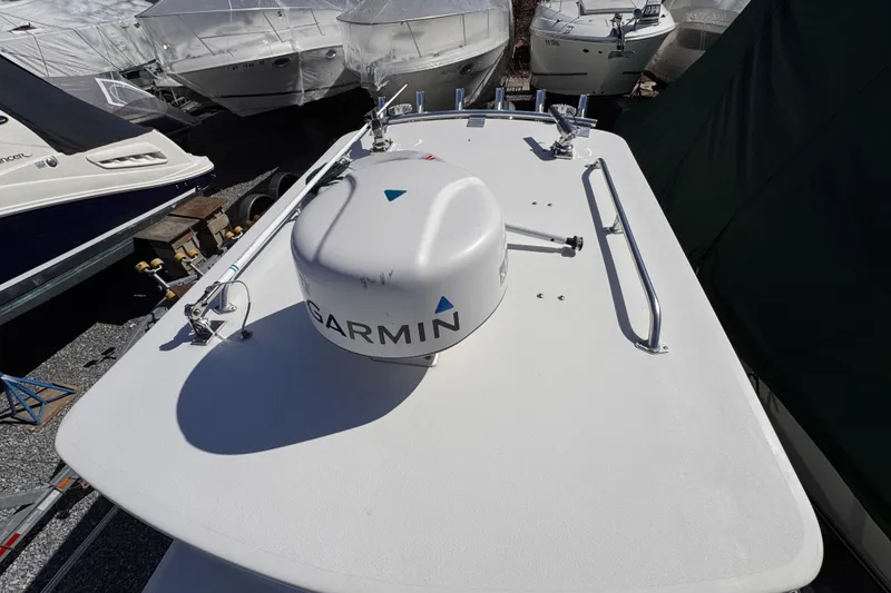 Slide: The Image of 2021 Steiger Craft 25 Chesapeake boat with Garmin radar, docked among other boats. - 30