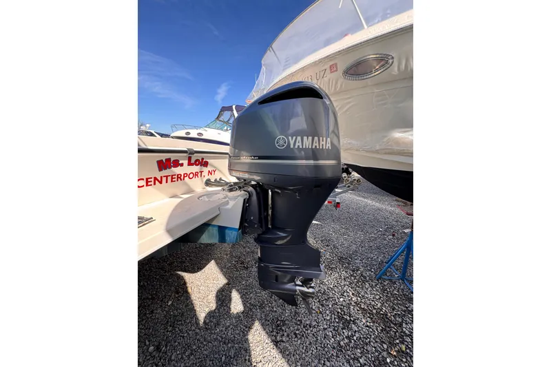 Slide: The Image of 2021 Steiger Craft 25 Chesapeake with Yamaha outboard motor, docked on gravel. - 4