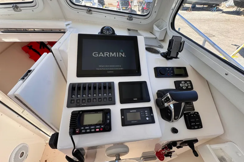 Slide: The Image of Helm of 2021 Steiger Craft 25 Chesapeake with Garmin navigation system and control panel. - 5