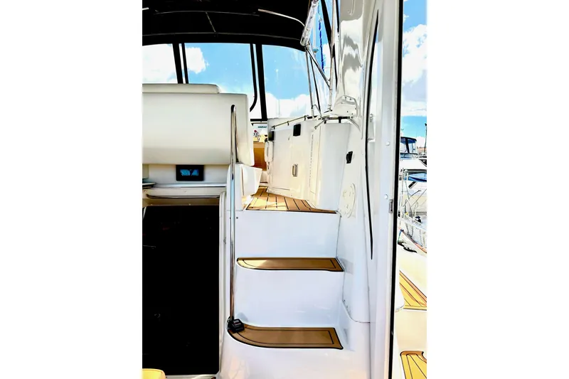 Slide: The Image of Staircase leading to cockpit on 2001 Carver 444 Cockpit Motor Yacht, featuring sleek design. - 10