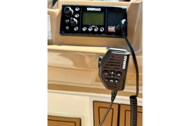 Slide: The Image of Simrad marine radio on 2001 Carver 444 Cockpit Motor Yacht dashboard. - 15