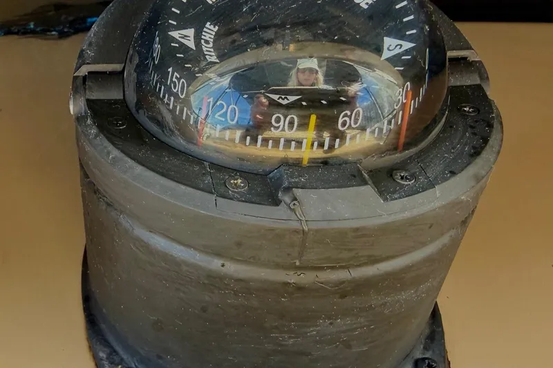 Slide: The Image of Compass on 2001 Carver 444 Cockpit Motor Yacht, showing navigation directions. - 20