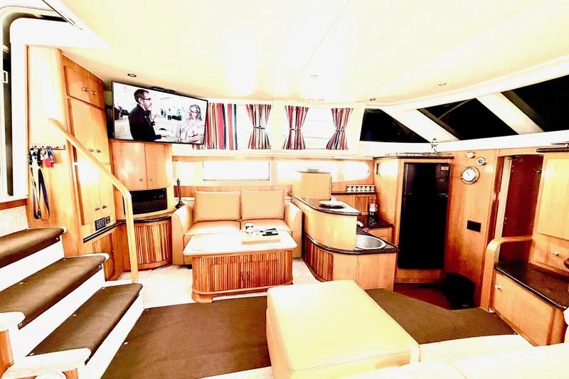 Slide: The Image of Luxurious interior of 2001 Carver 444 Cockpit Motor Yacht with modern amenities. - 24