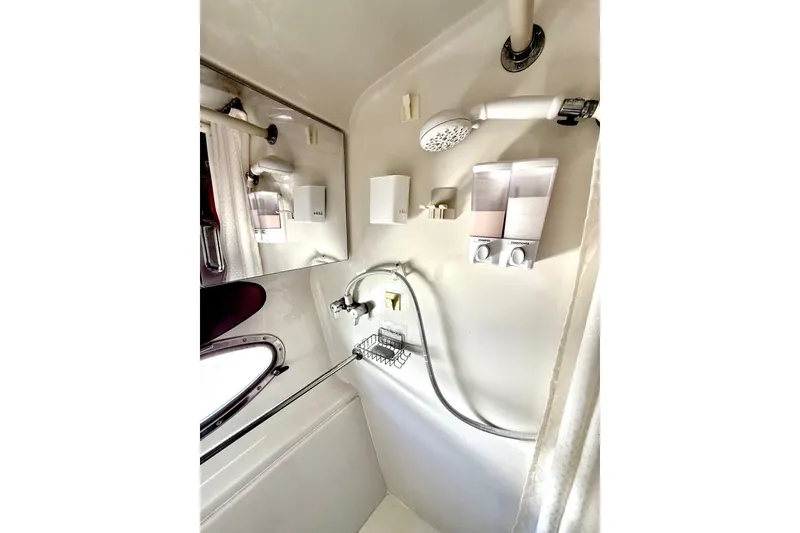 Slide: The Image of Bathroom of 2001 Carver 444 Cockpit Motor Yacht with shower and dispensers. - 39