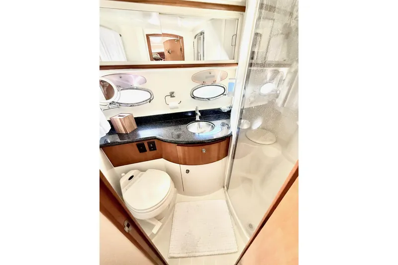 Slide: The Image of Bathroom interior of 2001 Carver 444 Cockpit Motor Yacht with shower and sink. - 47