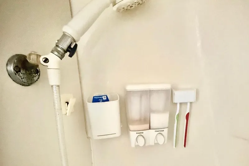 Slide: The Image of Shower area in 2001 Carver 444 Cockpit Motor Yacht with dispensers and toothbrushes. - 50