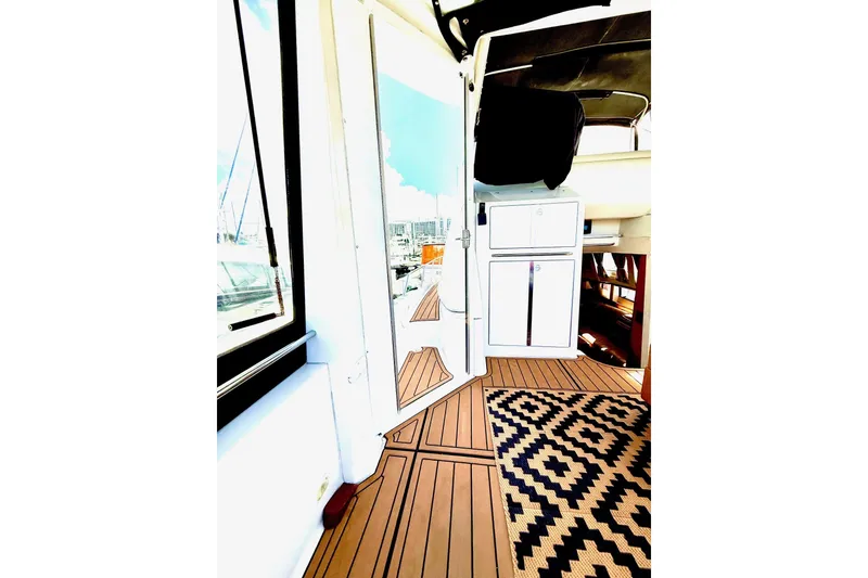 Slide: The Image of Heading up into the mid level covered cockpit area with new acrylic doors on either side. - 7