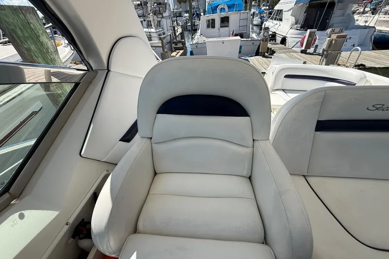 Slide: The Image of Captain's seat on a 2008 Sea Ray 38 Sundancer yacht at a marina. - 120
