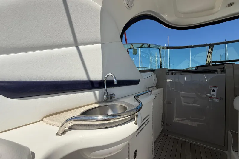 Slide: The Image of 2008 Sea Ray 38 Sundancer yacht interior with sink and sleek design. - 125