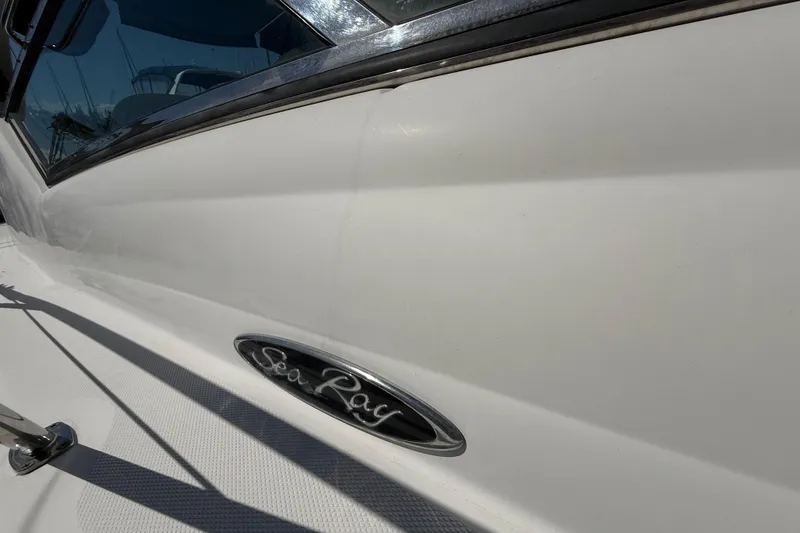 Slide: The Image of Close-up of 2008 Sea Ray 38 Sundancer boat exterior with logo. - 19