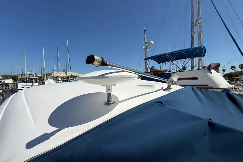 Slide: The Image of 2008 Sea Ray 38 Sundancer yacht docked at marina under clear blue sky. - 26