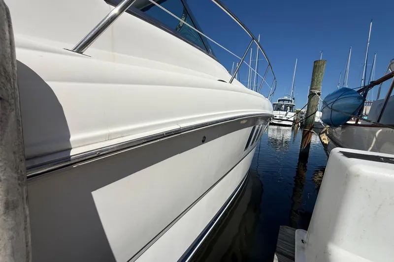 Slide: The Image of 2008 Sea Ray 38 Sundancer yacht docked at marina under clear blue sky. - 31