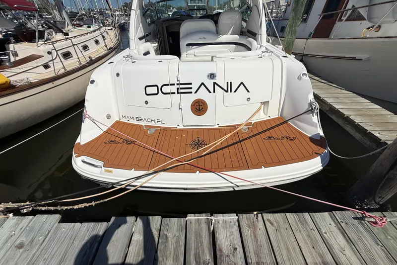 Slide: The Image of 2008 Sea Ray 38 Sundancer docked, rear view with teak deck, Miami Beach, FL. - 38