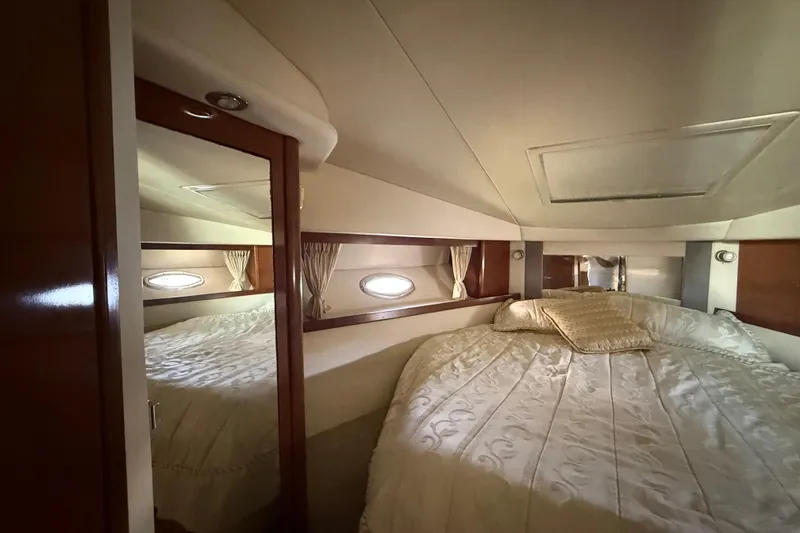 Slide: The Image of Luxurious cabin interior of 2008 Sea Ray 38 Sundancer yacht with elegant bedding. - 39