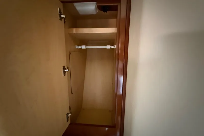 Slide: The Image of Empty wooden cabinet inside 2008 Sea Ray 38 Sundancer yacht. - 42