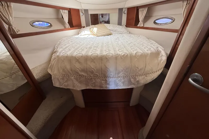 Slide: The Image of Luxurious cabin interior of 2008 Sea Ray 38 Sundancer yacht with elegant bedding. - 52