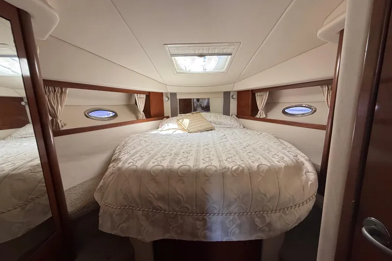 Slide: The Image of Luxurious cabin interior of 2008 Sea Ray 38 Sundancer yacht with elegant bedding. - 54