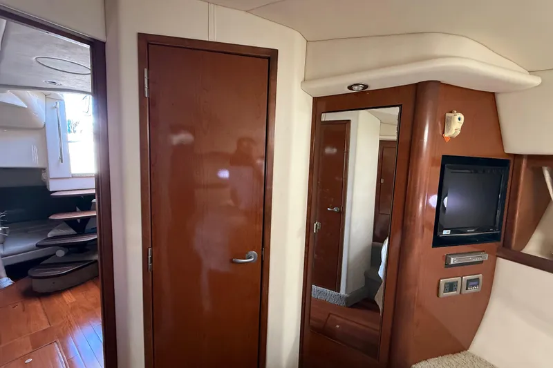 Slide: The Image of Interior of 2008 Sea Ray 38 Sundancer yacht with wood finishes and built-in TV. - 63