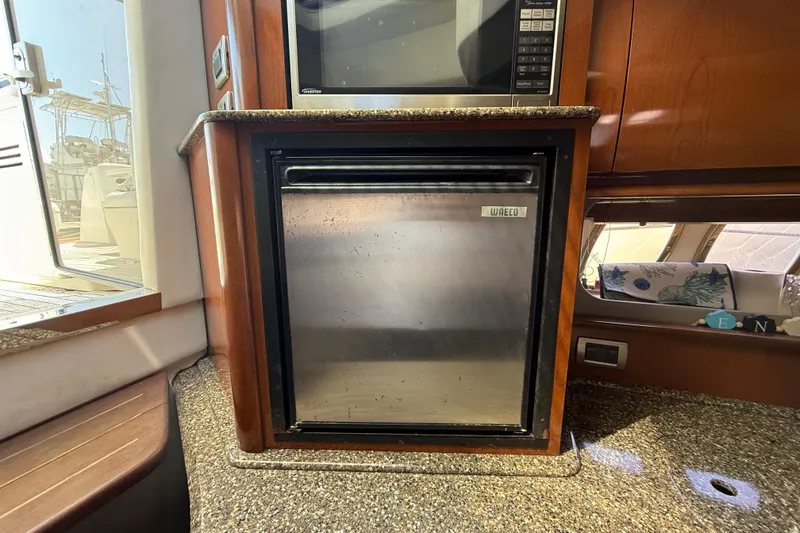 Slide: The Image of Interior of 2008 Sea Ray 38 Sundancer with compact fridge and microwave. - 73