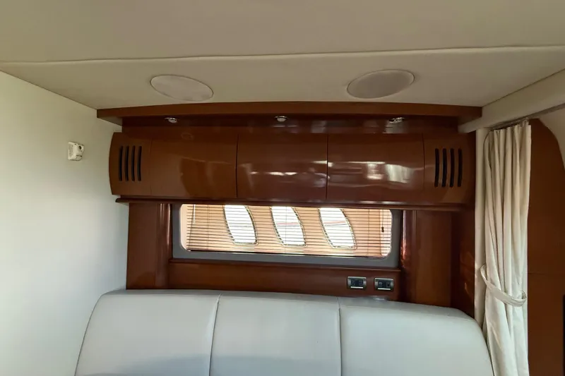 Slide: The Image of Interior of 2008 Sea Ray 38 Sundancer yacht with wood cabinetry and window blinds. - 75