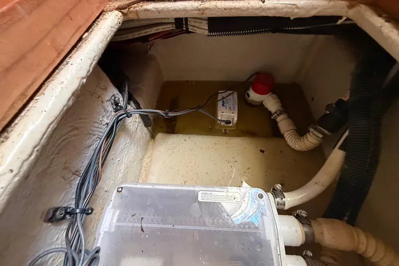 Slide: The Image of Bilge area of a 2008 Sea Ray 38 Sundancer with wiring and pump components. - 79