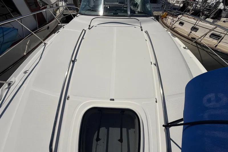 Slide: The Image of 2008 Sea Ray 38 Sundancer yacht deck with sleek design and stainless steel railings. - 8