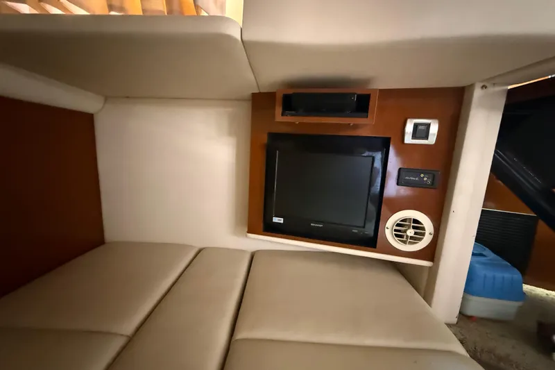 Slide: The Image of Interior of 2008 Sea Ray 38 Sundancer with TV and beige seating area. - 89
