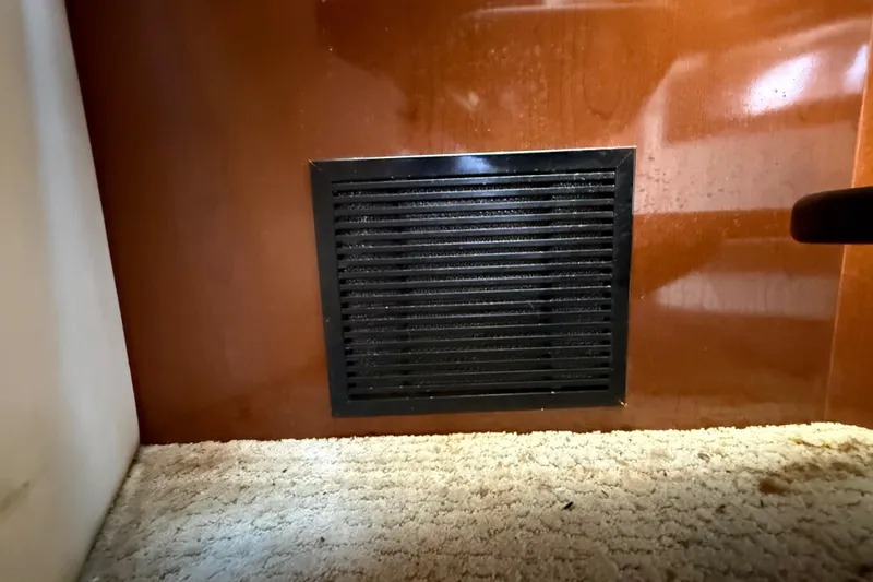 Slide: The Image of Vent on carpeted floor of 2008 Sea Ray 38 Sundancer yacht interior. - 92