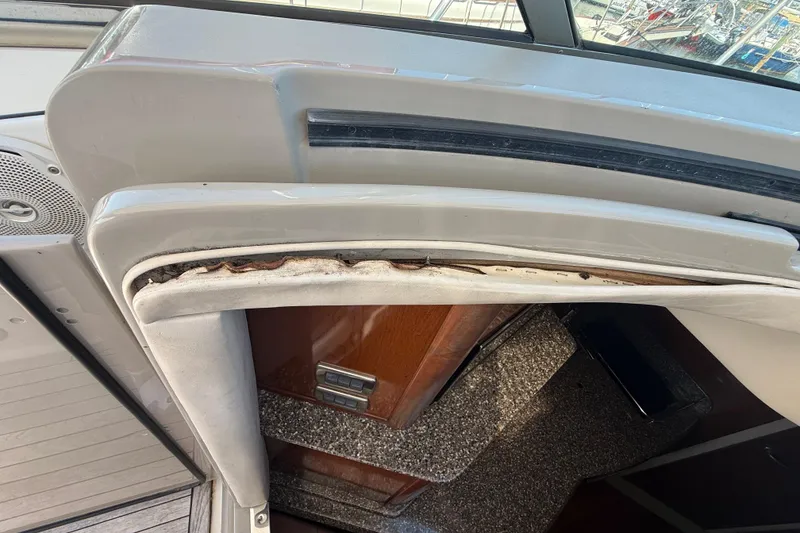 Slide: The Image of 2008 Sea Ray 38 Sundancer interior showing wear and damage near cabin entrance. - 98