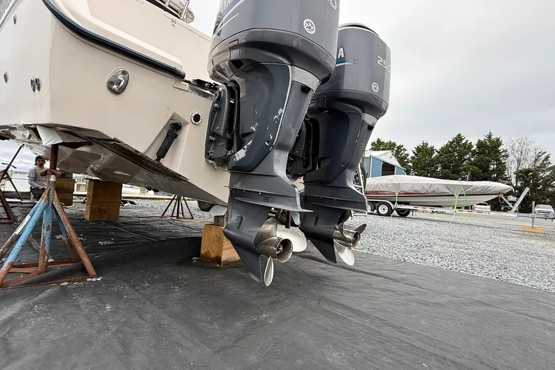 Slide: The Image of 2005 Grady-White Marlin 300 boat with dual outboard motors on stands. - 14