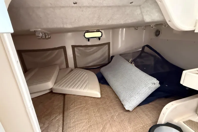 Slide: The Image of Interior cabin of 2005 Grady-White Marlin 300 boat with cushions and storage. - 15