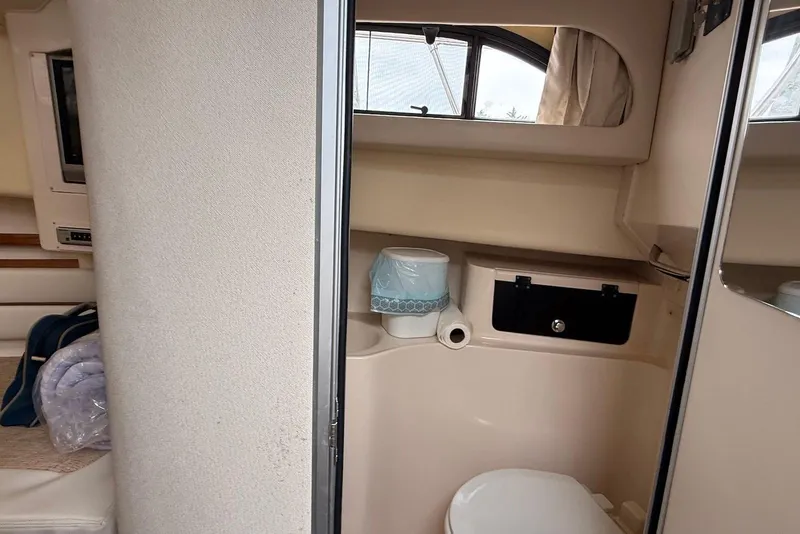 Slide: The Image of 2005 Grady-White Marlin 300 boat interior bathroom with toilet and sink. - 21