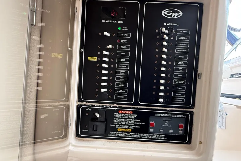Slide: The Image of Electrical control panel on a 2005 Grady-White Marlin 300 boat. - 23