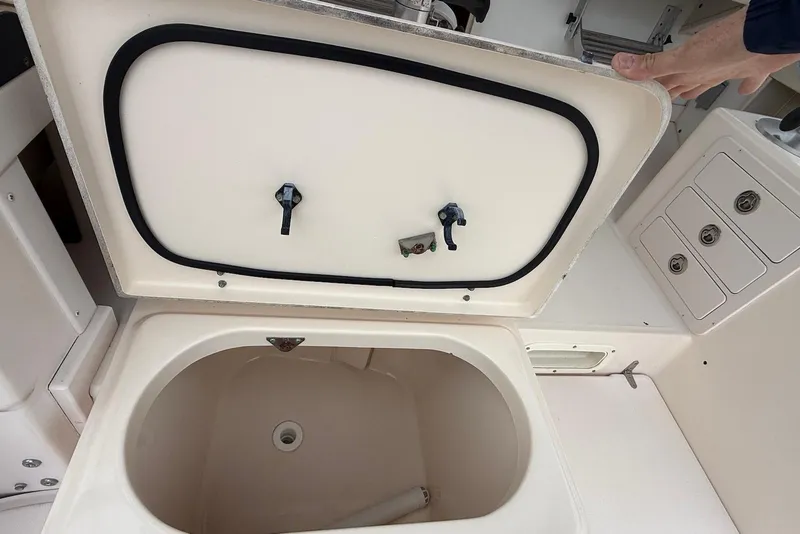 Slide: The Image of Open storage compartment on a 2005 Grady-White Marlin 300 boat interior. - 8