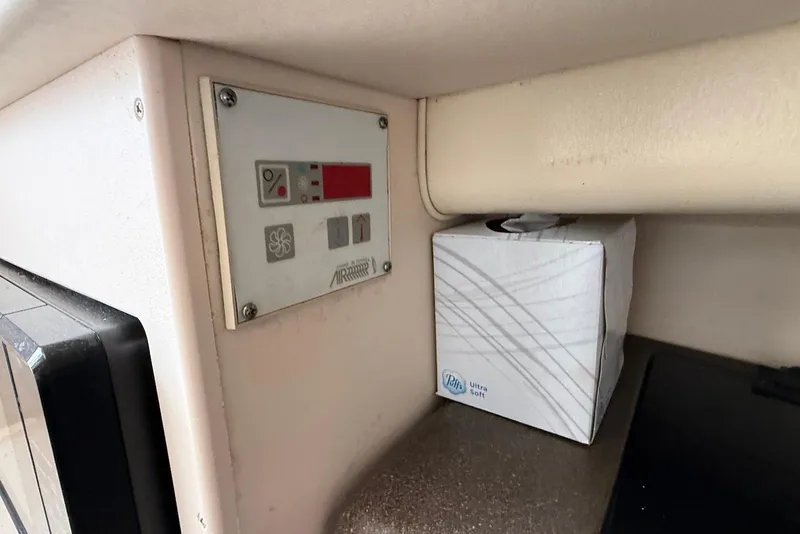Slide: The Image of Control panel and tissue box inside a 2005 Grady-White Marlin 300 boat cabin. - 9