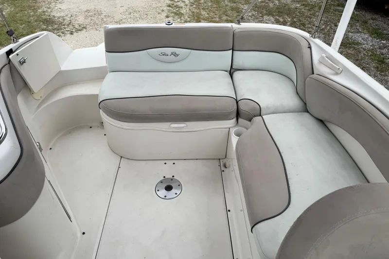 Slide: The Image of 2003 Sea Ray 240 Sundeck interior with spacious seating and elegant design. - 10