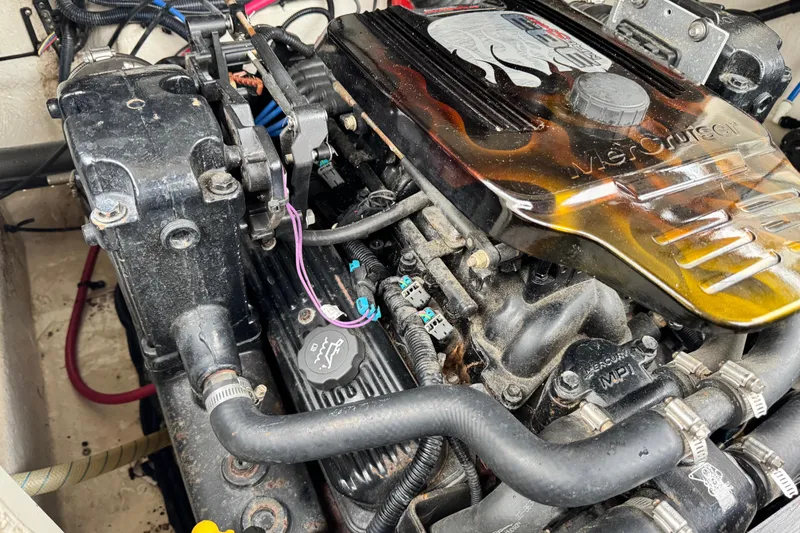 Slide: The Image of Engine of a 2003 Sea Ray 240 Sundeck boat, featuring MerCruiser components. - 24