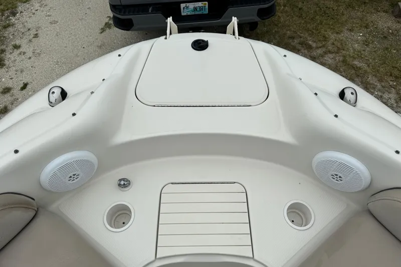 Slide: The Image of 2003 Sea Ray 240 Sundeck boat interior with speakers and cup holders. - 29
