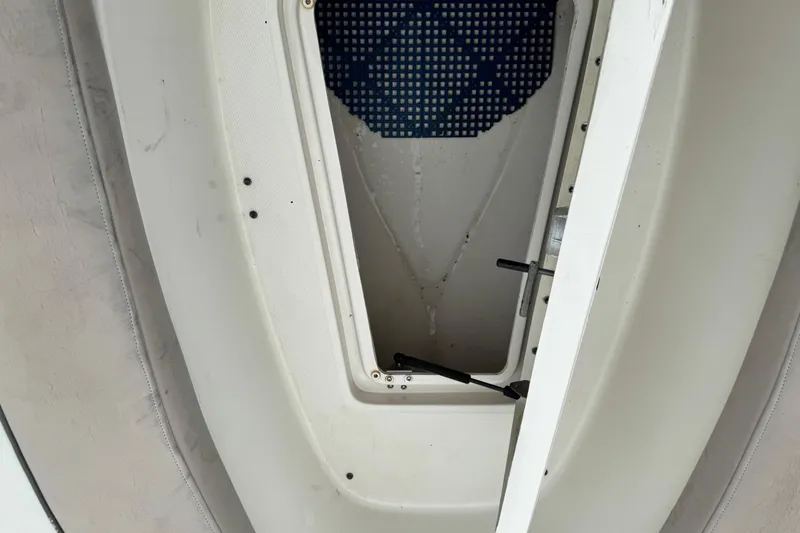 Slide: The Image of Open storage compartment on a 2003 Sea Ray 240 Sundeck boat. - 30