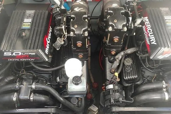Slide: The Image of Twin Mercury MerCruiser engines in a 2001 Sea Ray 290 Sundancer boat. - 12
