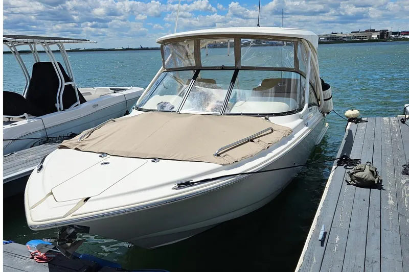 Slide: The Image of 2020 Scout 255 Dorado boat docked on a sunny day with clear skies. - 2